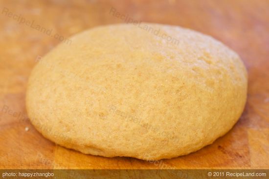 Coat the large bowl with cooking spray, place the dough into the bowl, and cover with plastic wrap or a clean and damp kitchen towel.