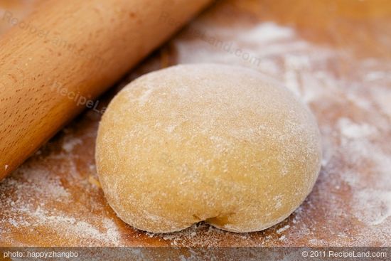 When the dough is ready, transfer it onto the floured surface,