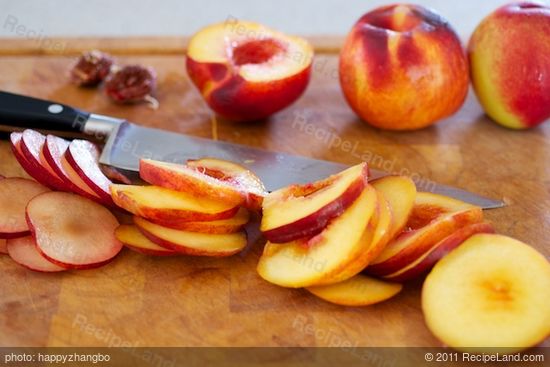 Half, core and slice the peaches or nectarines and plums into about 1/4-inch thick slices. Set aside. 