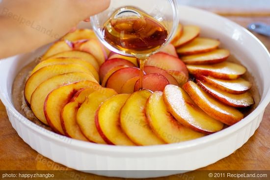 Drizzle the maple syrup over the fruits.