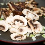 Add the mushrooms, stirring often,