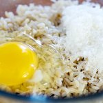 Add the cheese, egg and rice into a large bowl.