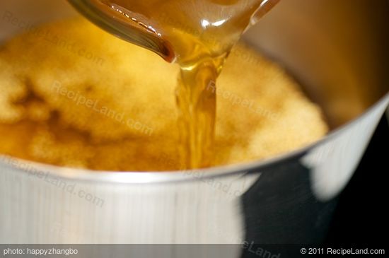 Transfer the toasted millet into a pot with the broth. 