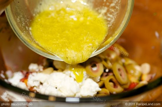 Pour the dressing into the bowl.