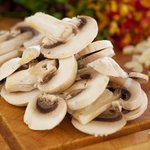 Slice 4 to 5 white button mushrooms.