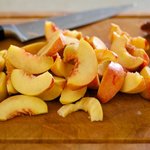 Slice the peaches into 1/2-inch slices.