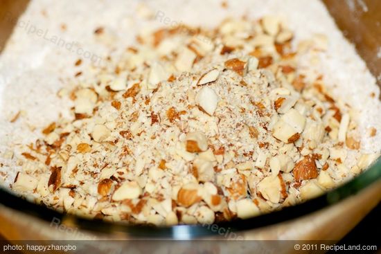 Add toasted almonds and chop coarsely, using 6 to 8 on/off turns. 