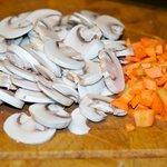 Slice the mushrooms and chop the carrot.