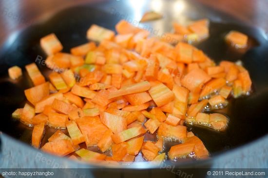 Add the carrots into a hot wok with a little oil,