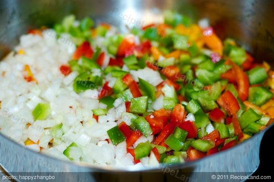 add the garlic, onions and green and red bell peppers,