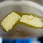 Melt butter in Dutch oven over high heat. 