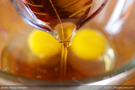 In a large bowl, add the eggs, maple syrup,