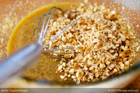 Add 1/2 cup chopped pecans into the large bowl,