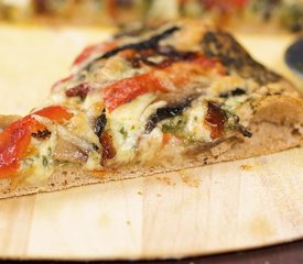 Basil Pesto, Roasted Pepper, Sun-dried Tomatoes and Portabella Mushrooms Pizza