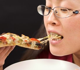 Basil Pesto, Roasted Pepper, Sun-dried Tomatoes and Portabella Mushrooms Pizza