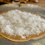 Sprinkle parmesan evenly over the crust.
