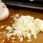 Mince a few fresh garlic cloves.