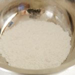 Place confectioners sugar in a large bowl, set aside.