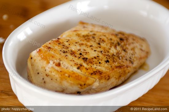 Remove the chicken breasts and arrange in a baking dish in a single layer. 