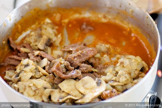 Return meat and mushrooms to skillet.