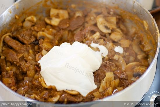 Stir in sour cream; cook,