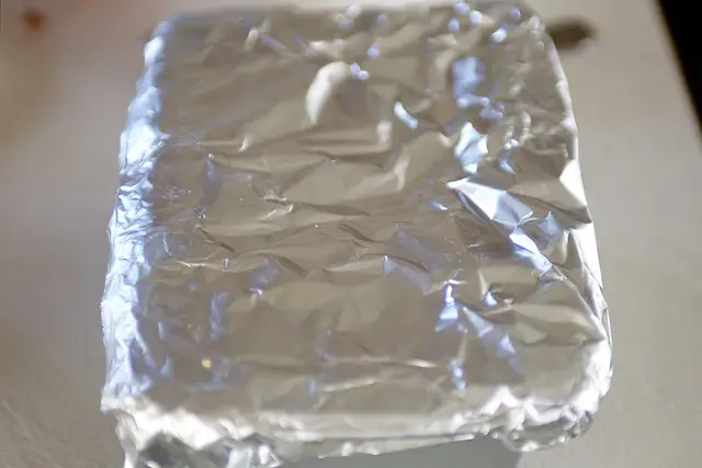 Cover dough with extended ends of foil.