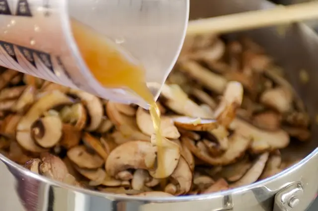 Pour stock into skillet.