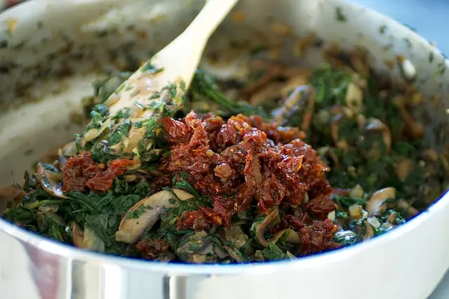 and sun-dried tomatoes. Stir well.