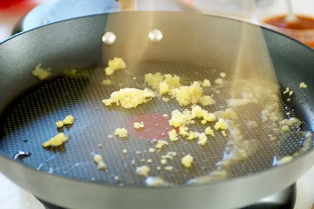 Heat a 14-inch flat-bottomed wok or large skillet over high heat until hot.