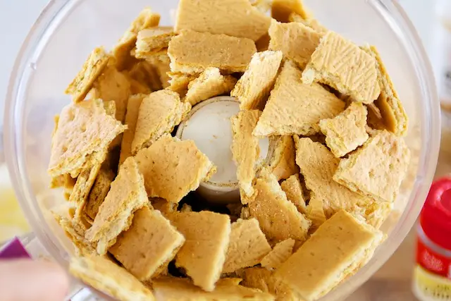 Add the crackers into a food processor.