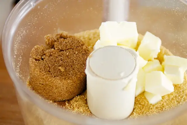 Next add butter, sugar and spices into the fine crumbs.