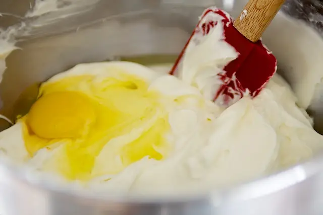 Add eggs, one at a time, 