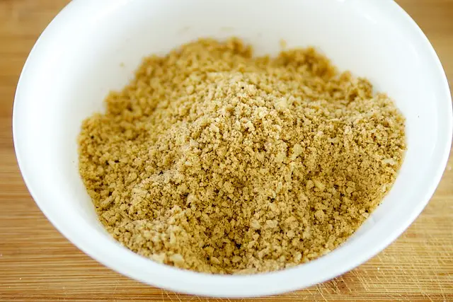 Blend until the tortillas become the consistency of cornmeal. 