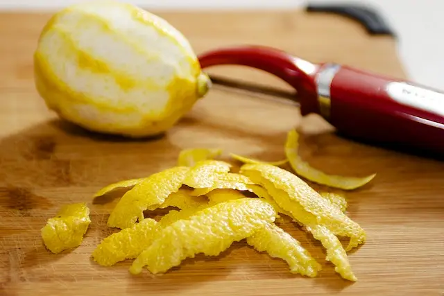 Meanwhile peel the lemon peels into strips.