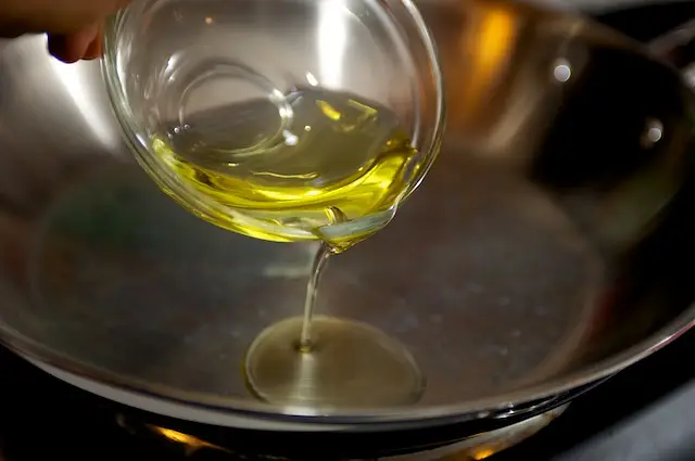 Next heat the olive oil over medium-high heat in a skillet until hot.