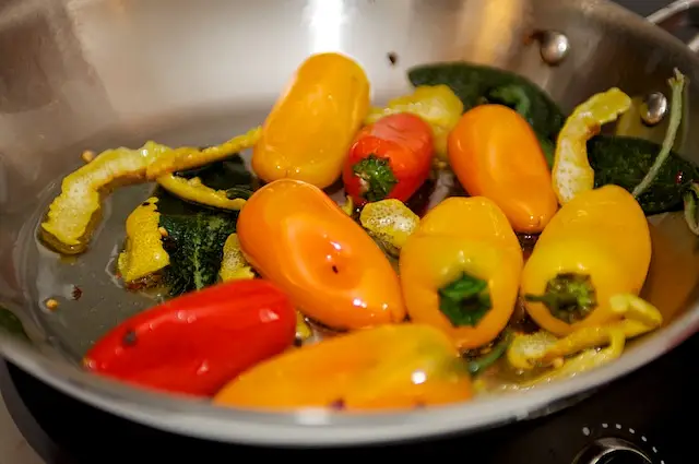 Stir in the baby bell peppers,