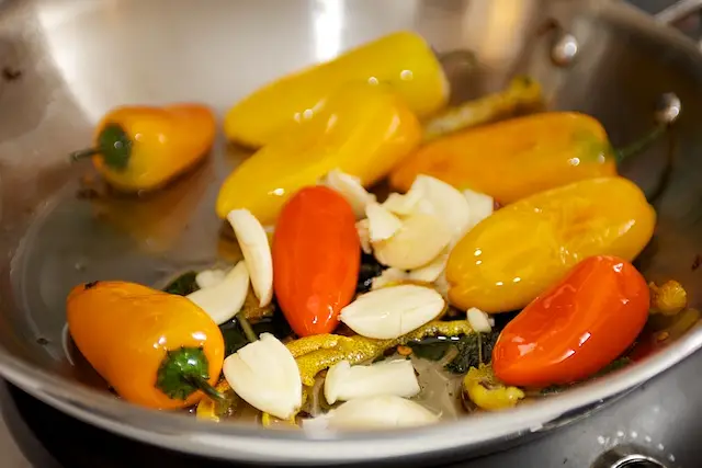 Add the slightly flattened garlic 