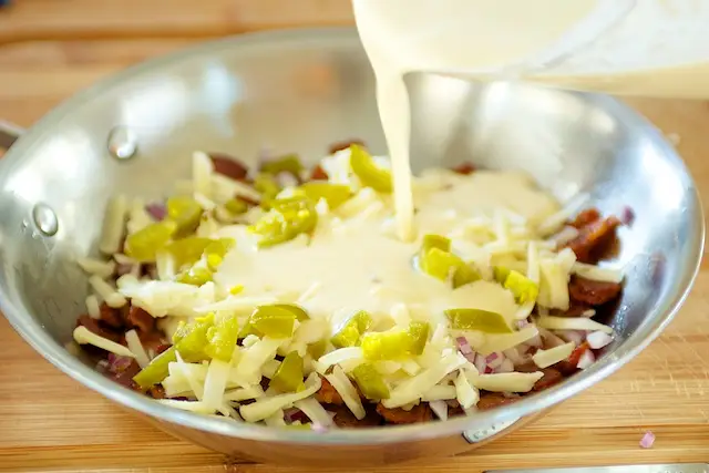 Slowly pour into the skillet