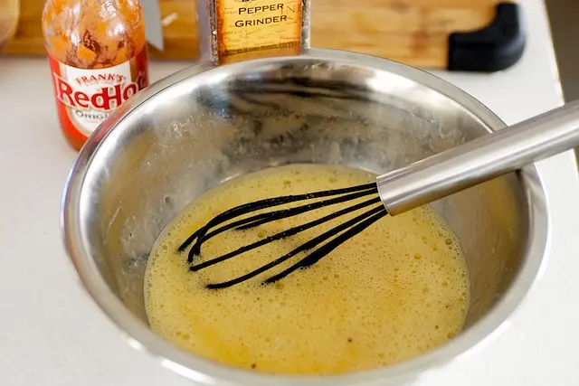 Beat the eggs in a large bowl