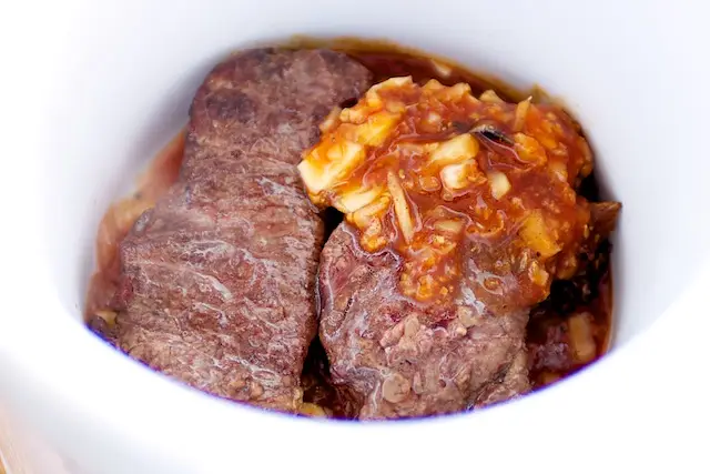 Transfer the ribs to the slow cooker.  