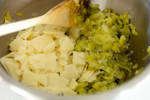 Transfer cooked leeks along with Swiss cheese in a large bowl. Mix well.