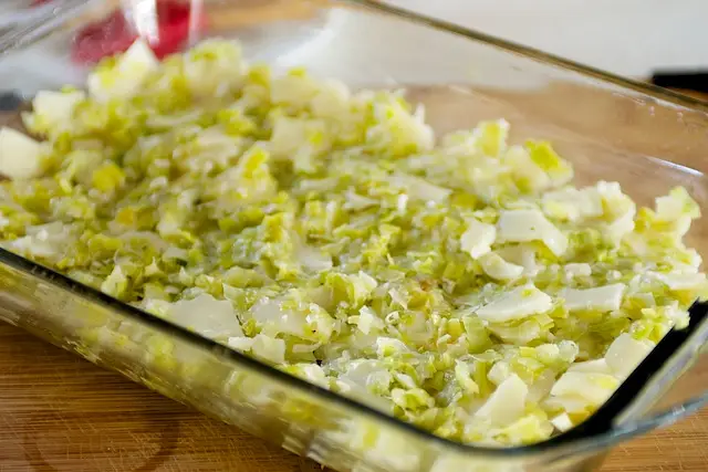 Spread leek-cheese mixture evenly onto bottom of pie plate.  