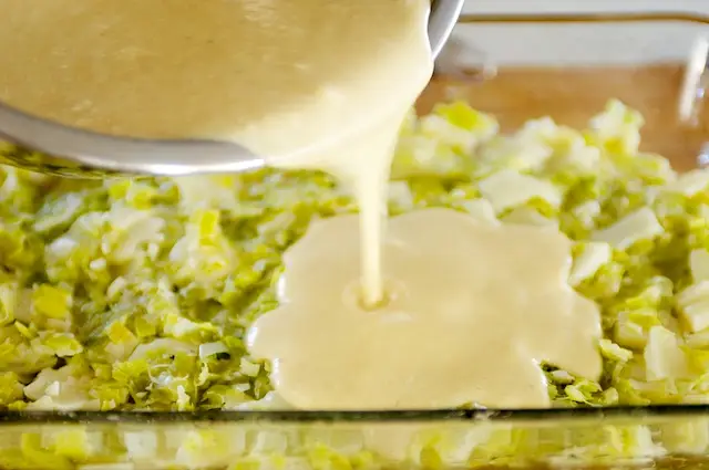 Pour into plate over leeks and cheese. 
