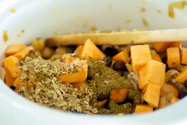 Add all the dry spices. Stir well.