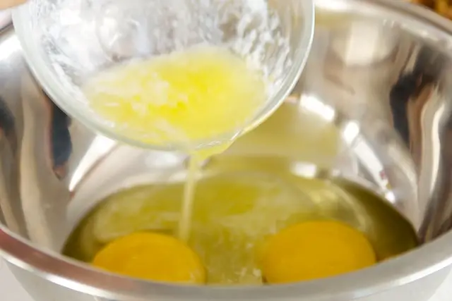 Pour melted butter in.
