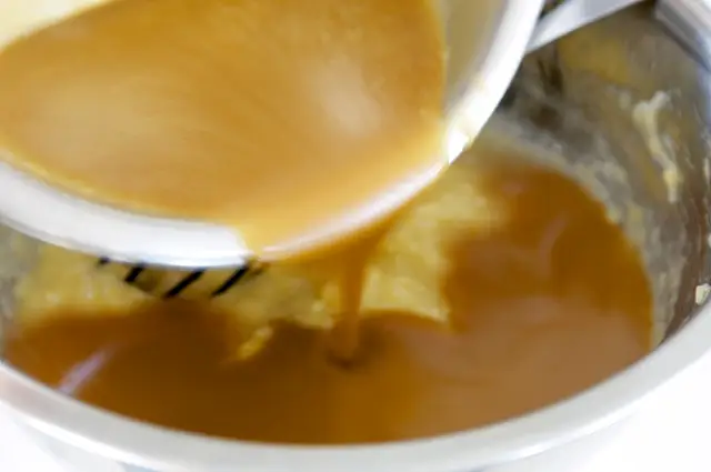Pour the liquid mixture into mashed bananas. Stir well.
