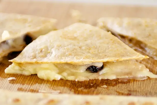 Cut each quesadilla into three wedges.