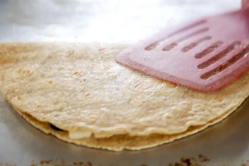 Press it down with a spatula.
