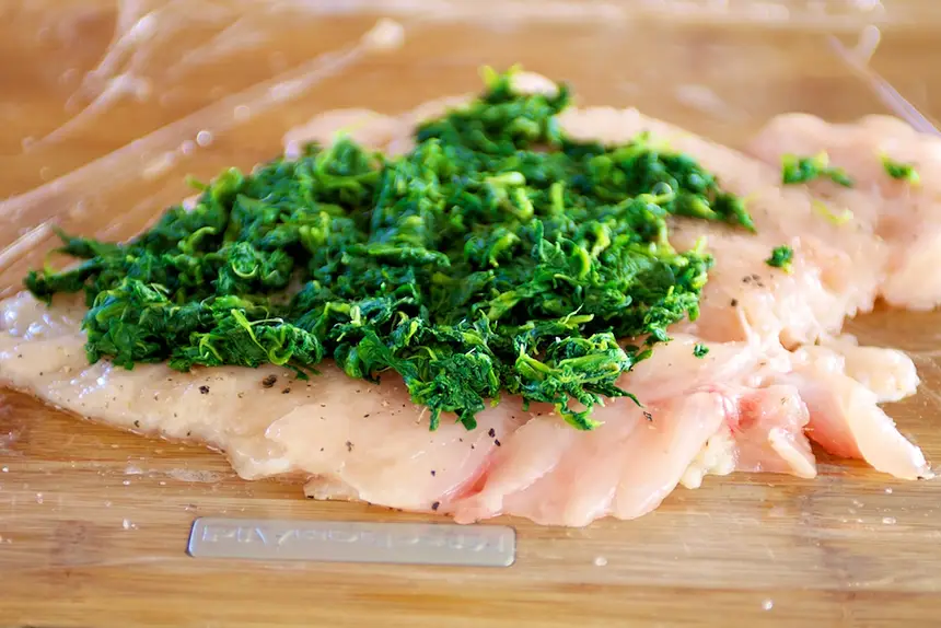Place the spinach on the prepared chicken.