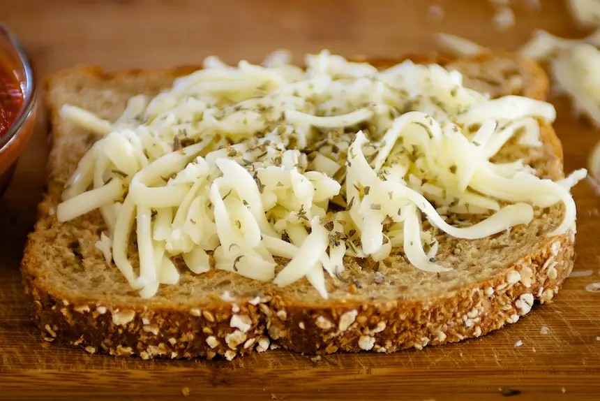 Next sprinkle Italian seasoning over cheese.